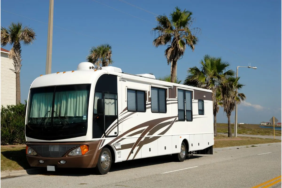 A photo of recreational vehicle stopping by at the side of the road.