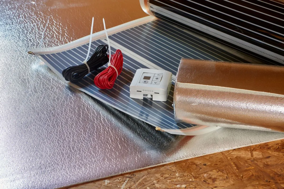 Installing a radiant electrical heating in the floor of a recreational van.