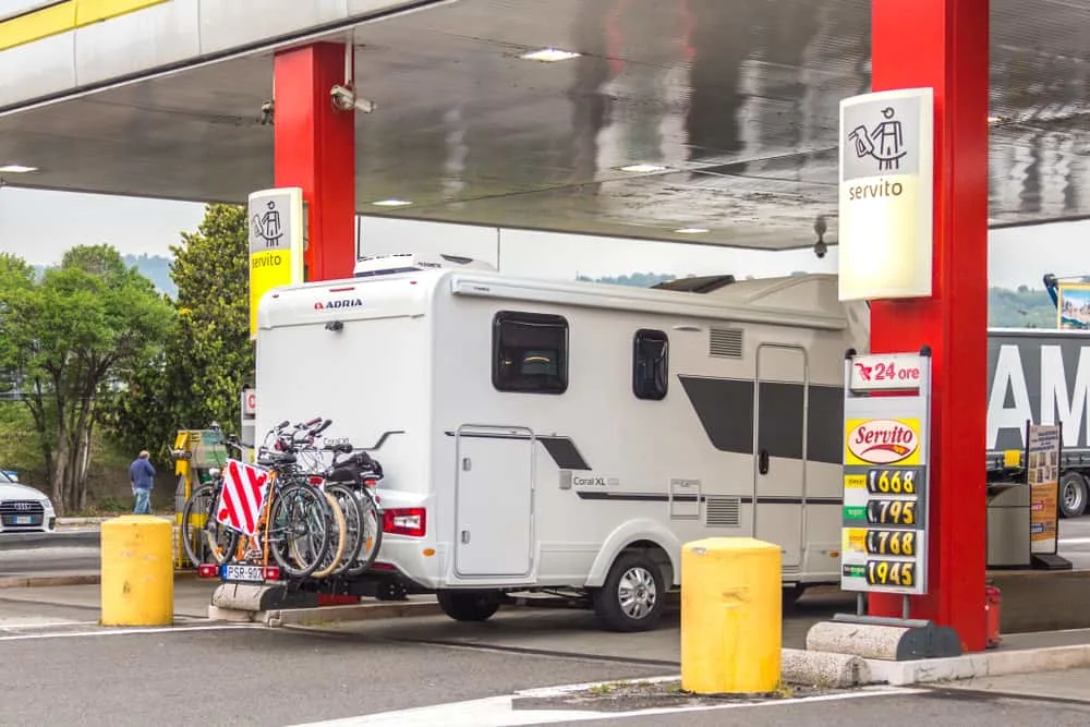 This is a close look at an RV having its gas pumped.