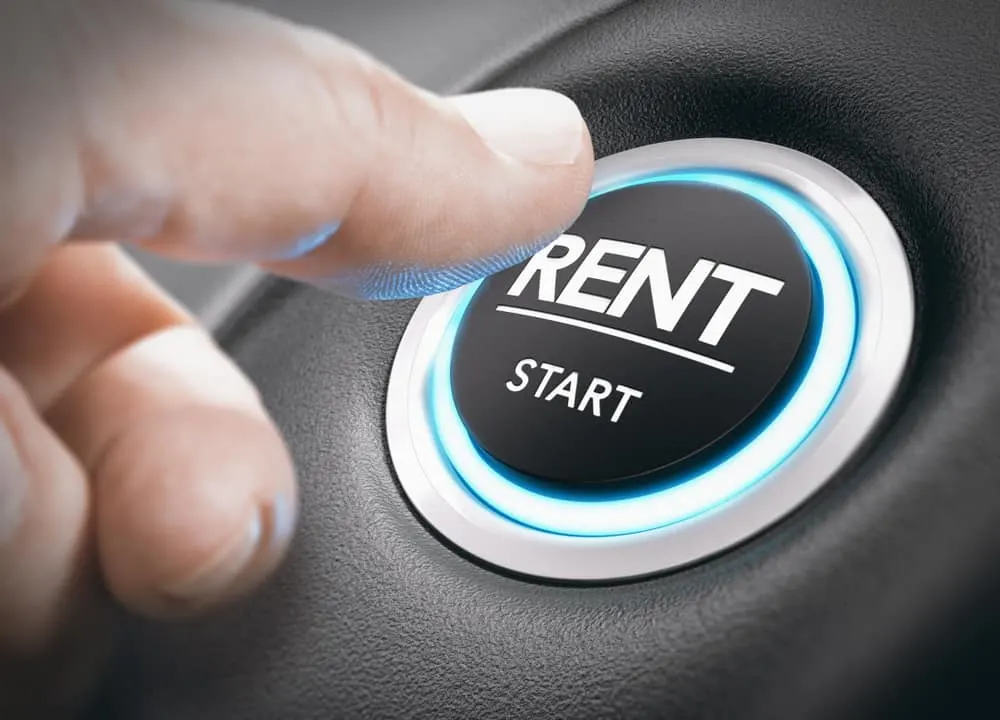 A person about to push the rent start button.