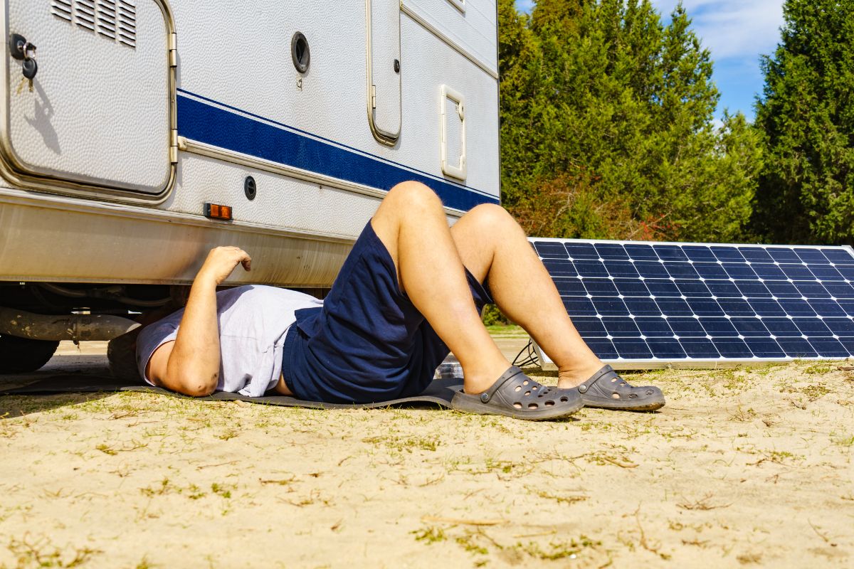 A man checking RV Catalytic Converter.