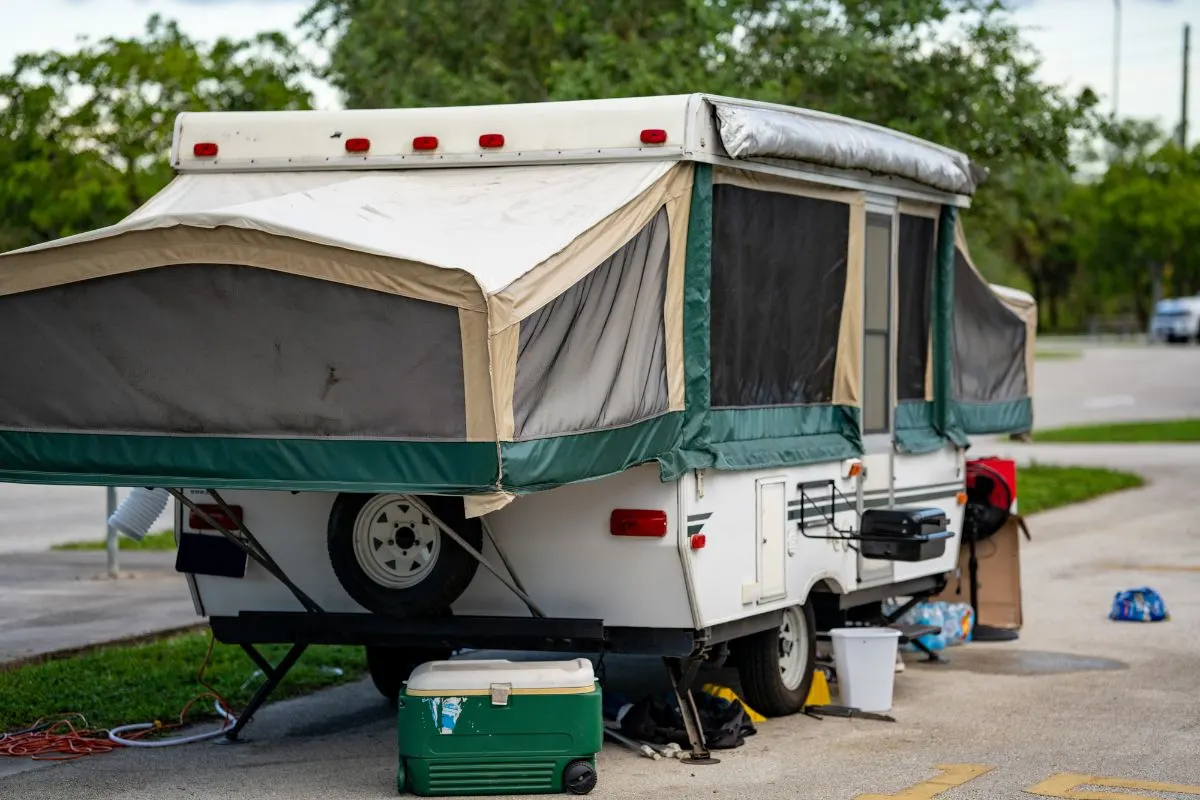 Back view of Pop-up camper on camp site.