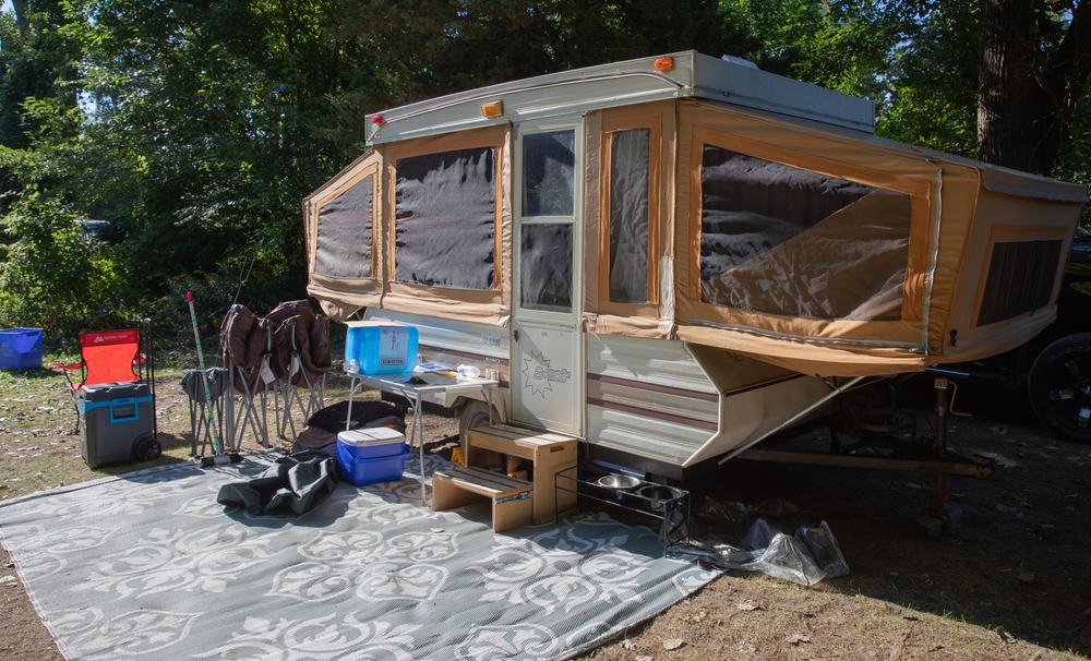 This is a close look at a pop up trailer camp setup with all the camping essentials.