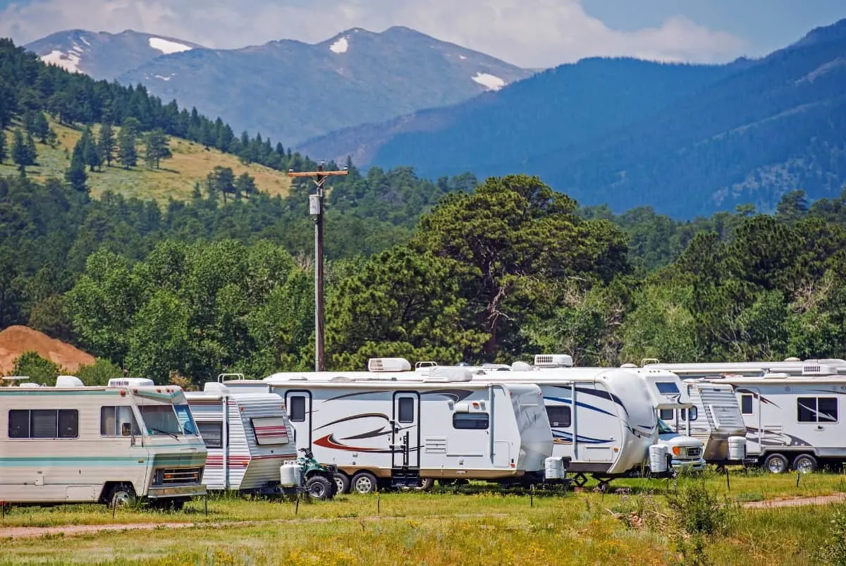 RVs parked against the mountains.