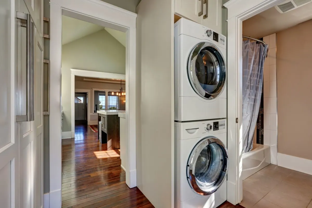 A photo of built in laundry appliances in bathroom.