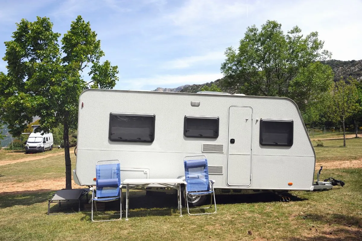 Side view of stand-up trailer on camp area.