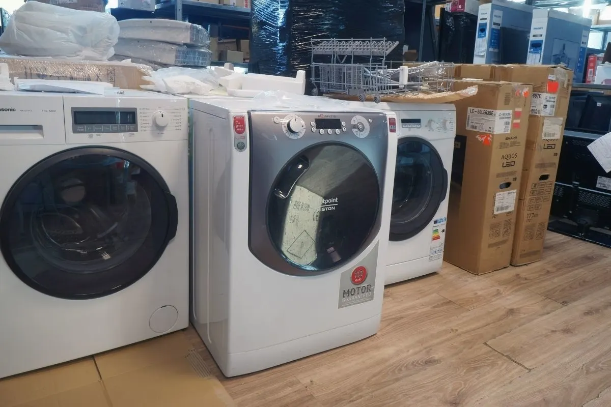 A photo of three vented washer and dryer for repair.