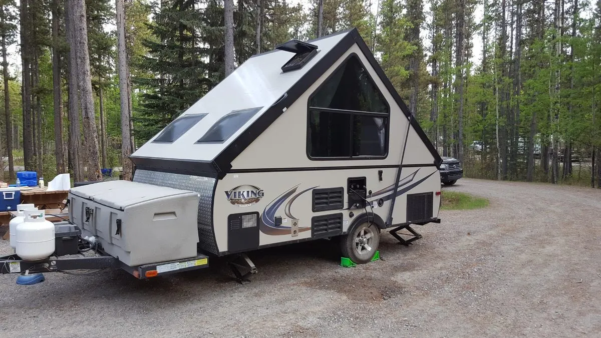 An A-Frame trailer on camp site.