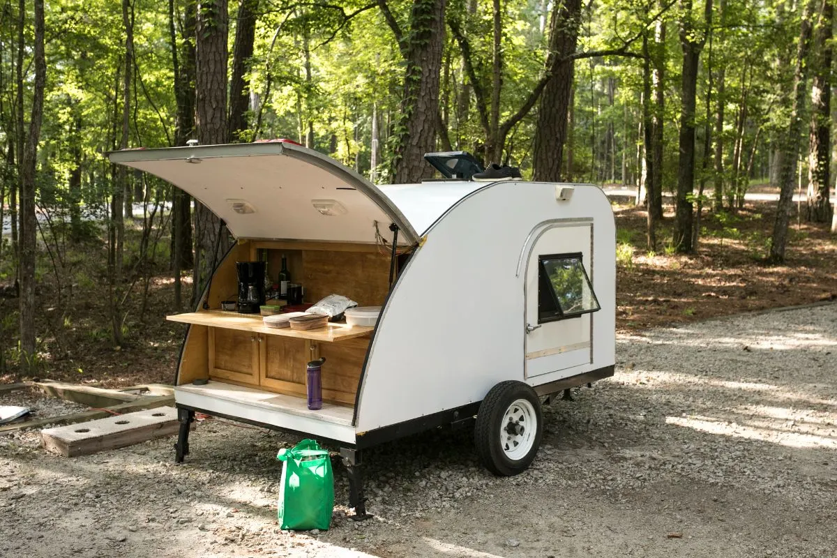 A Teardrop camper on camp site.