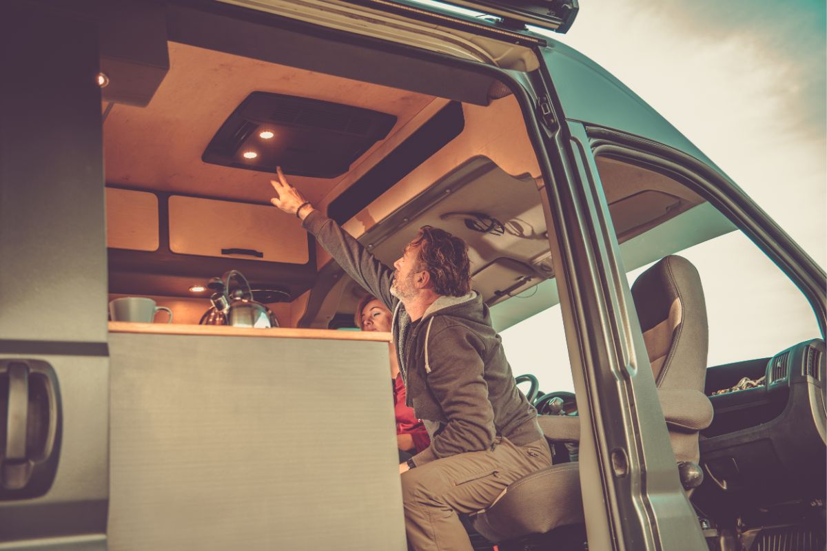 A photo of man pressing the button of rv air conditioner.