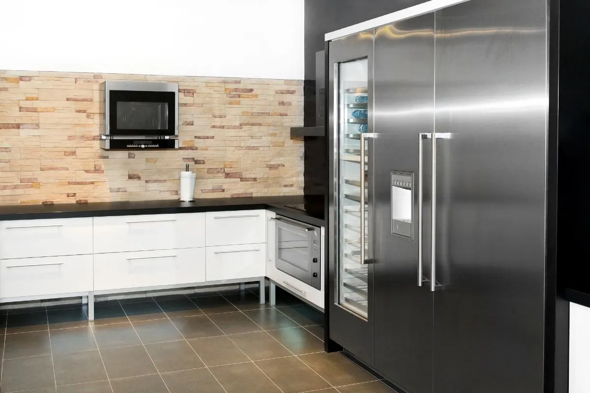 A modern kitchen with household fridge.