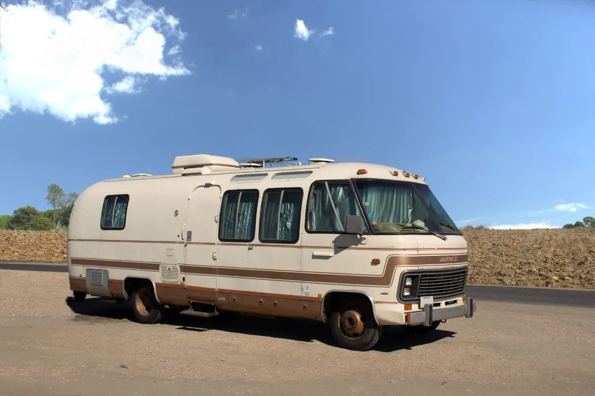 An old RV on road.