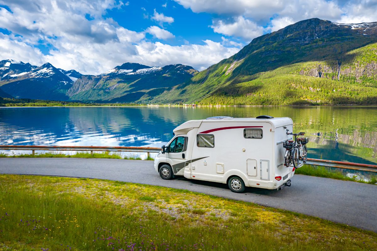 RV on road near the lake.