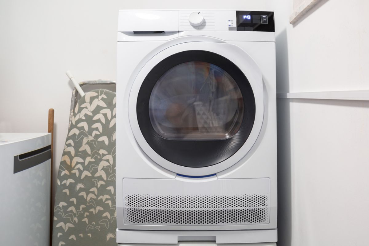 A average size washer and dryer combo inside a recreational vehicle.