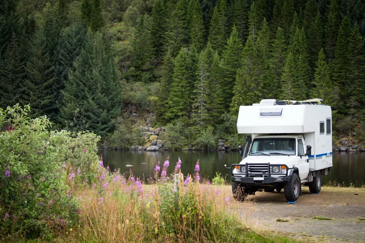 Thor Gemini AWD 23 TW Class B+ RV on camp site.