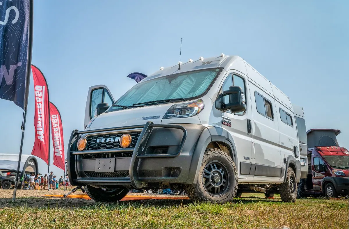 Winnebago Class B RV on camp site.