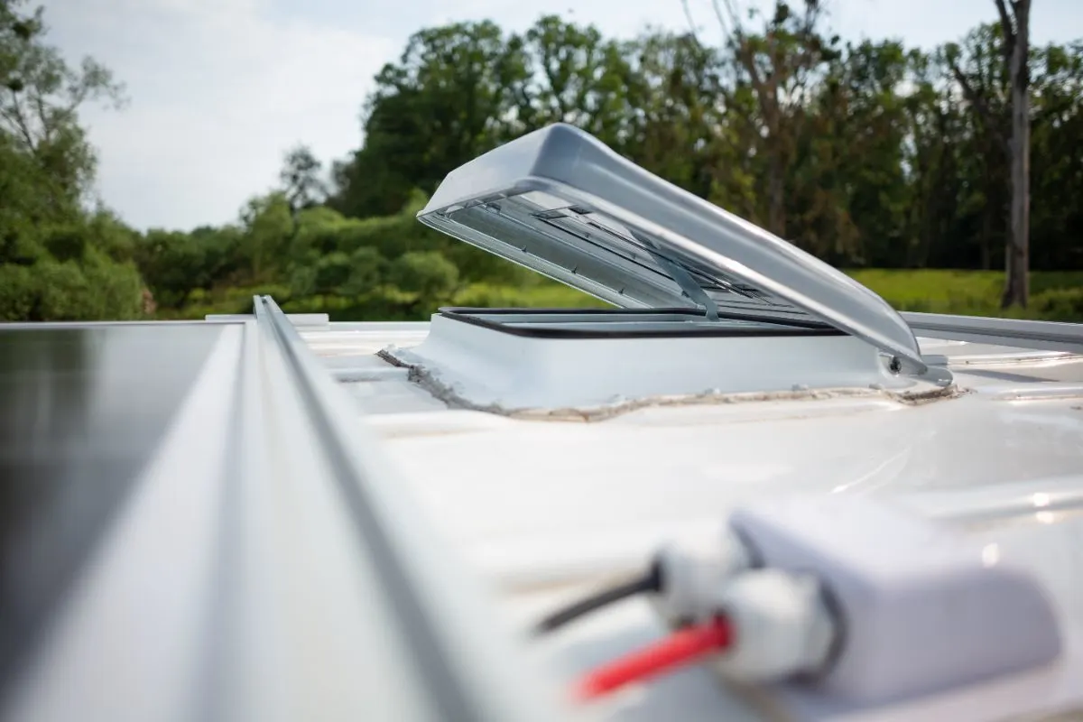 Close up photo of open roof hatch on a camper van.