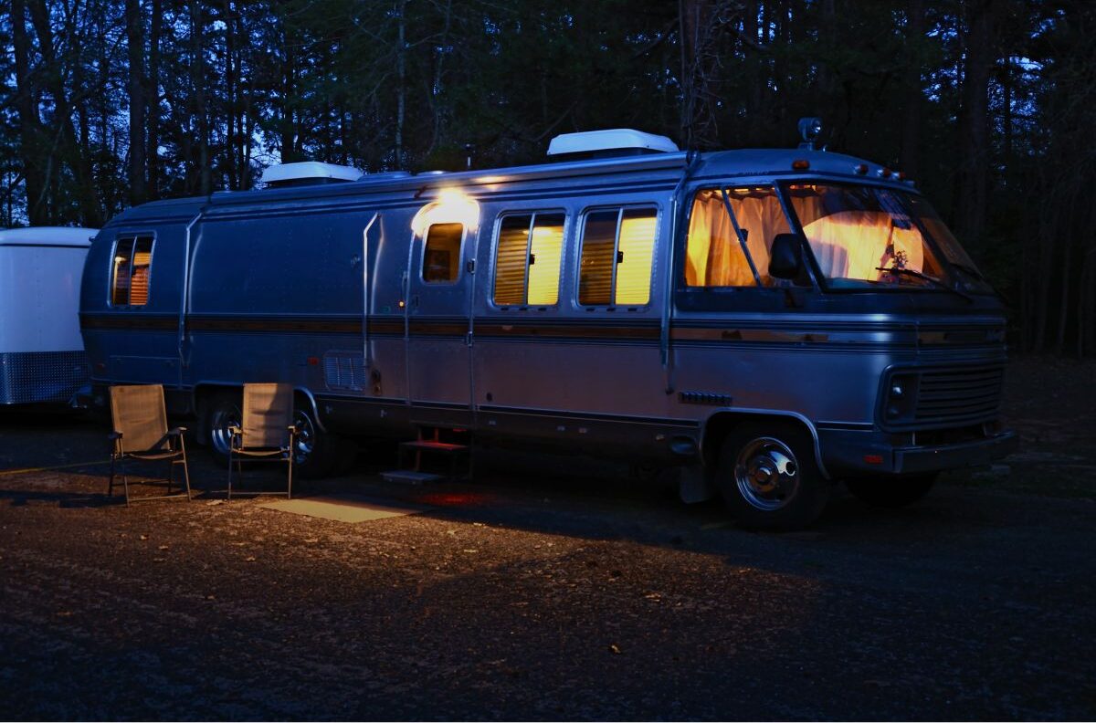 A side view of rv aluminum at night.