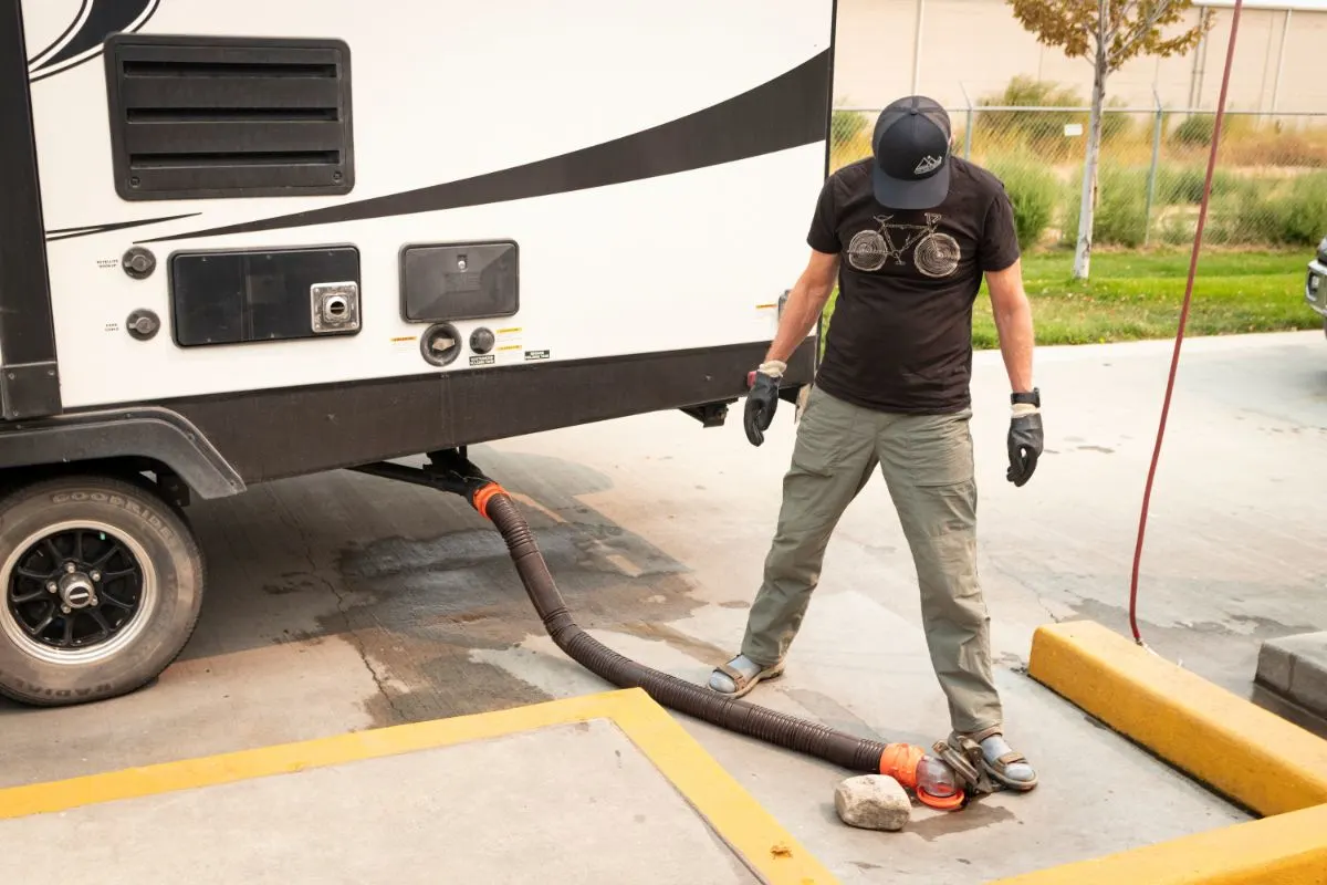 Man emptied waste from RV black water tank.