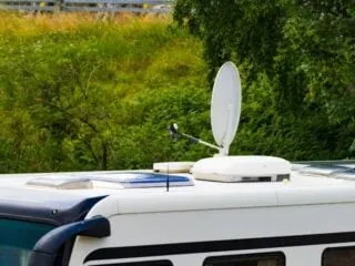 A photo of satellite dish on roof of camper van.