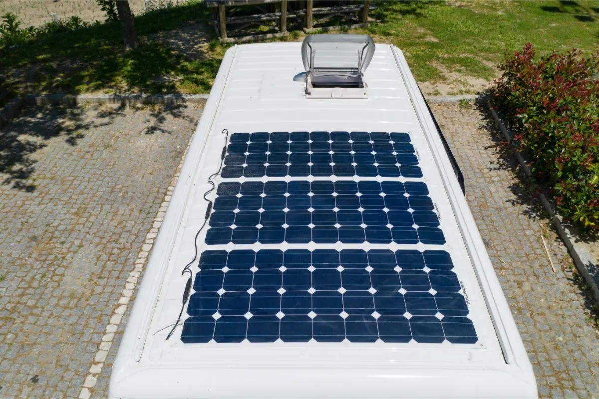 Top view image of camper van solar roof panels with skylight.