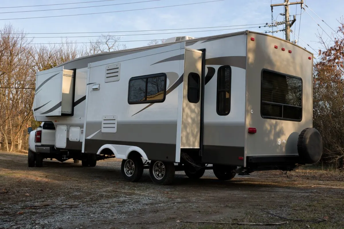 RV on camp site with extended slide out.