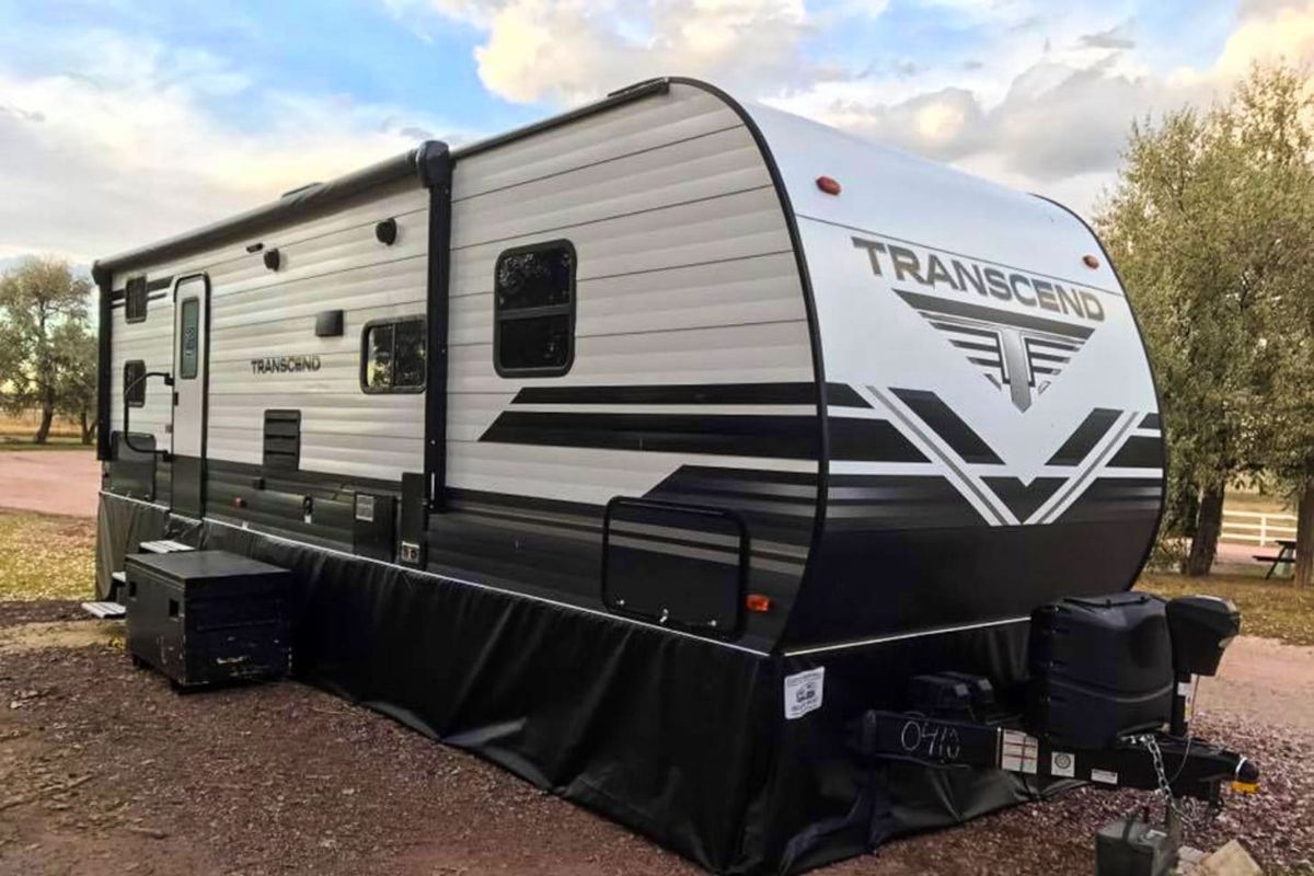 Transcend RV or recreational van with black customized vinyl skirt.