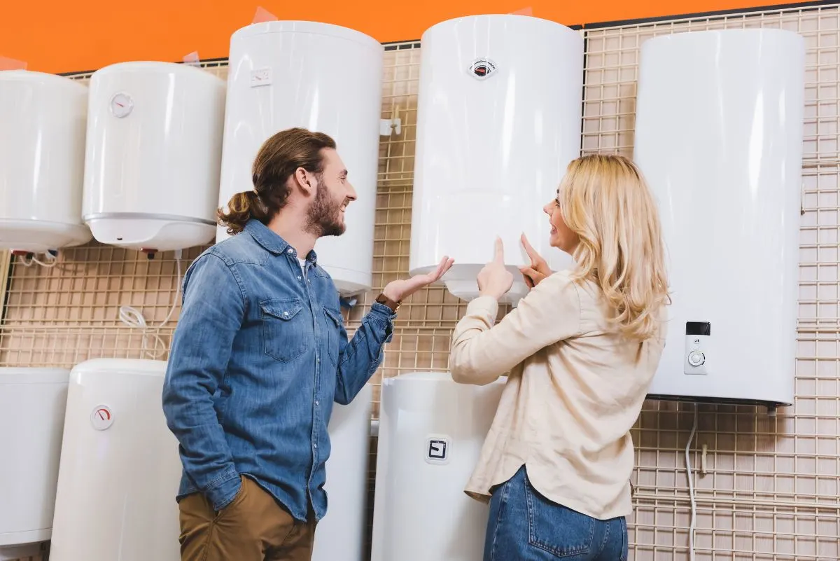 Man and woman choosing water heater at the store.