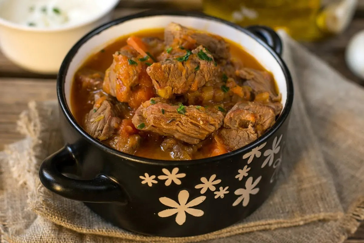 A bowl full of beef stew.