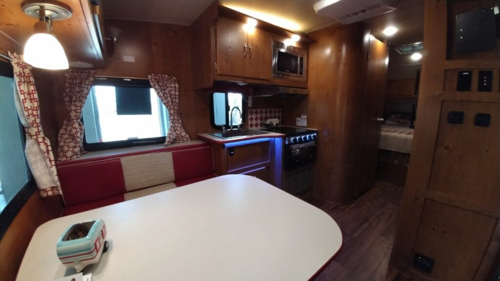 Kitchen of the RV with overhead cabinets.