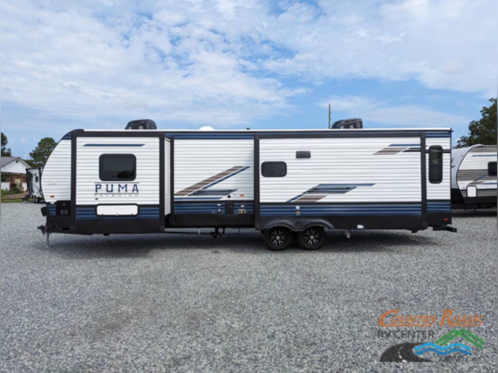 Side view of the New 2024 Palomino PUMA 31RLQS Travel Trailer RV.