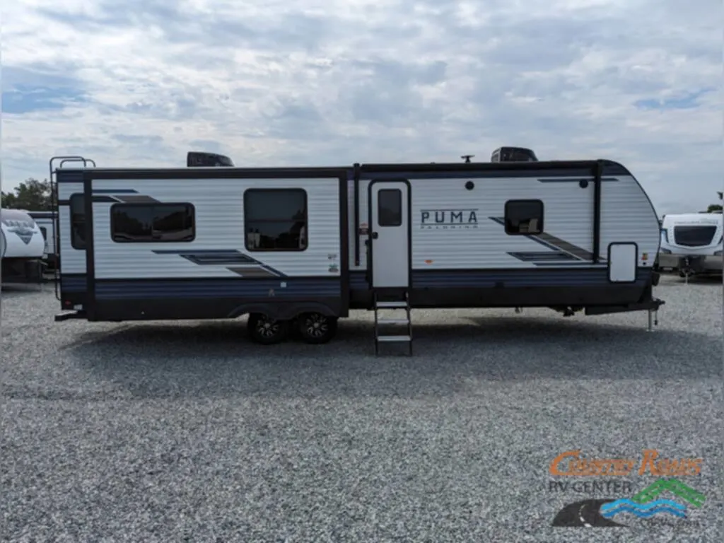 Side view of the New 2024 Palomino PUMA 31RLQS Travel Trailer RV.