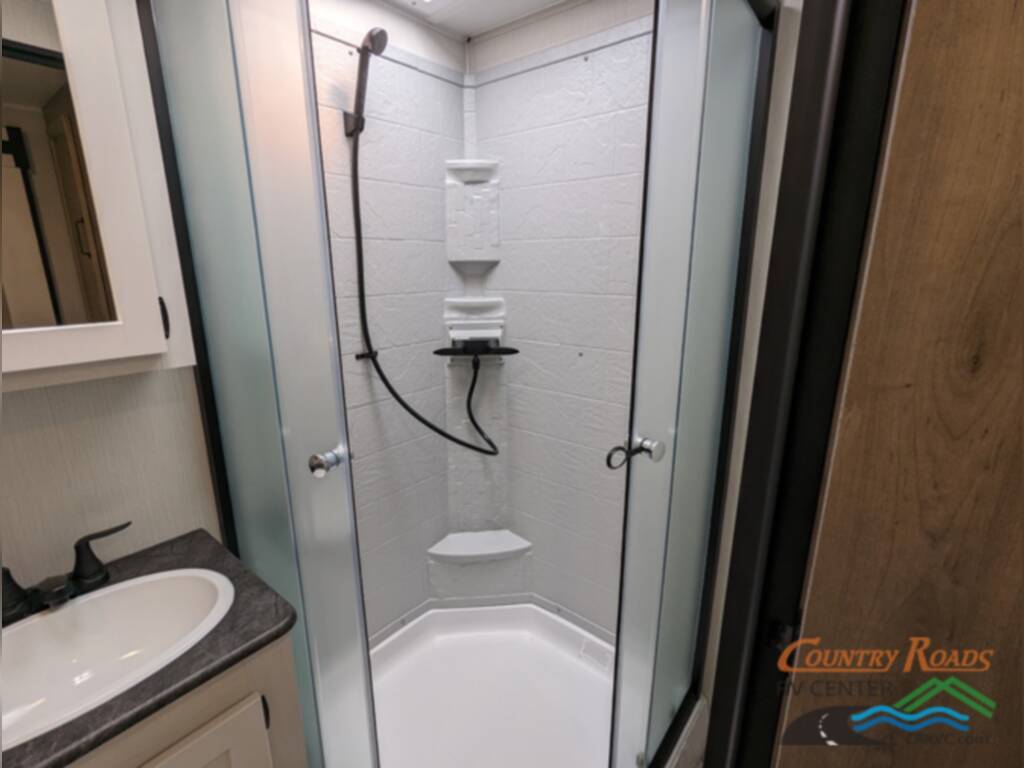 Bathroom with a sink and a walk-in shower.