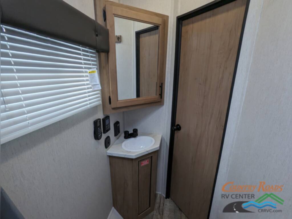 Bathroom with an overhead cabinet and a sink vanity.