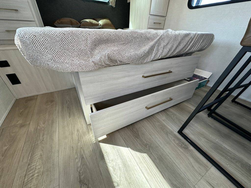 Bedroom with drawers under the bed.