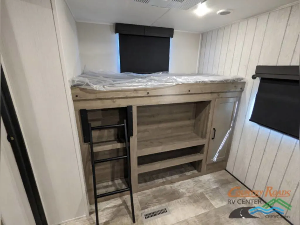 Bedroom with foldable bunk beds.