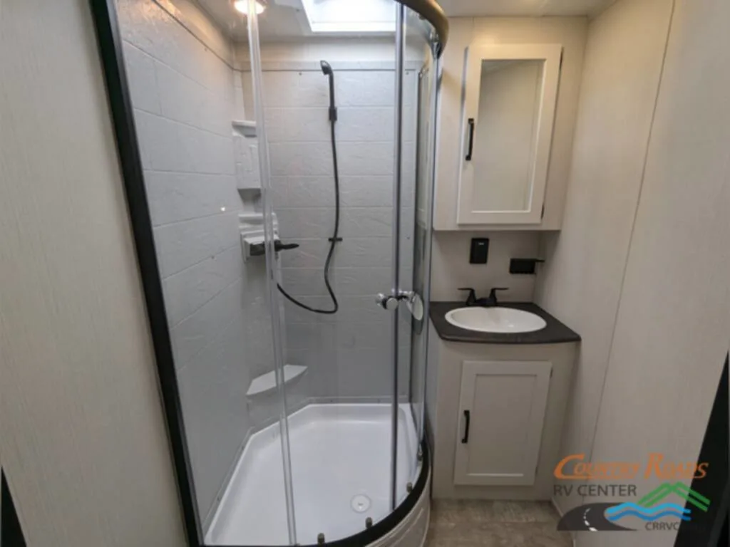 Bathroom with a sink and a walk-in shower.