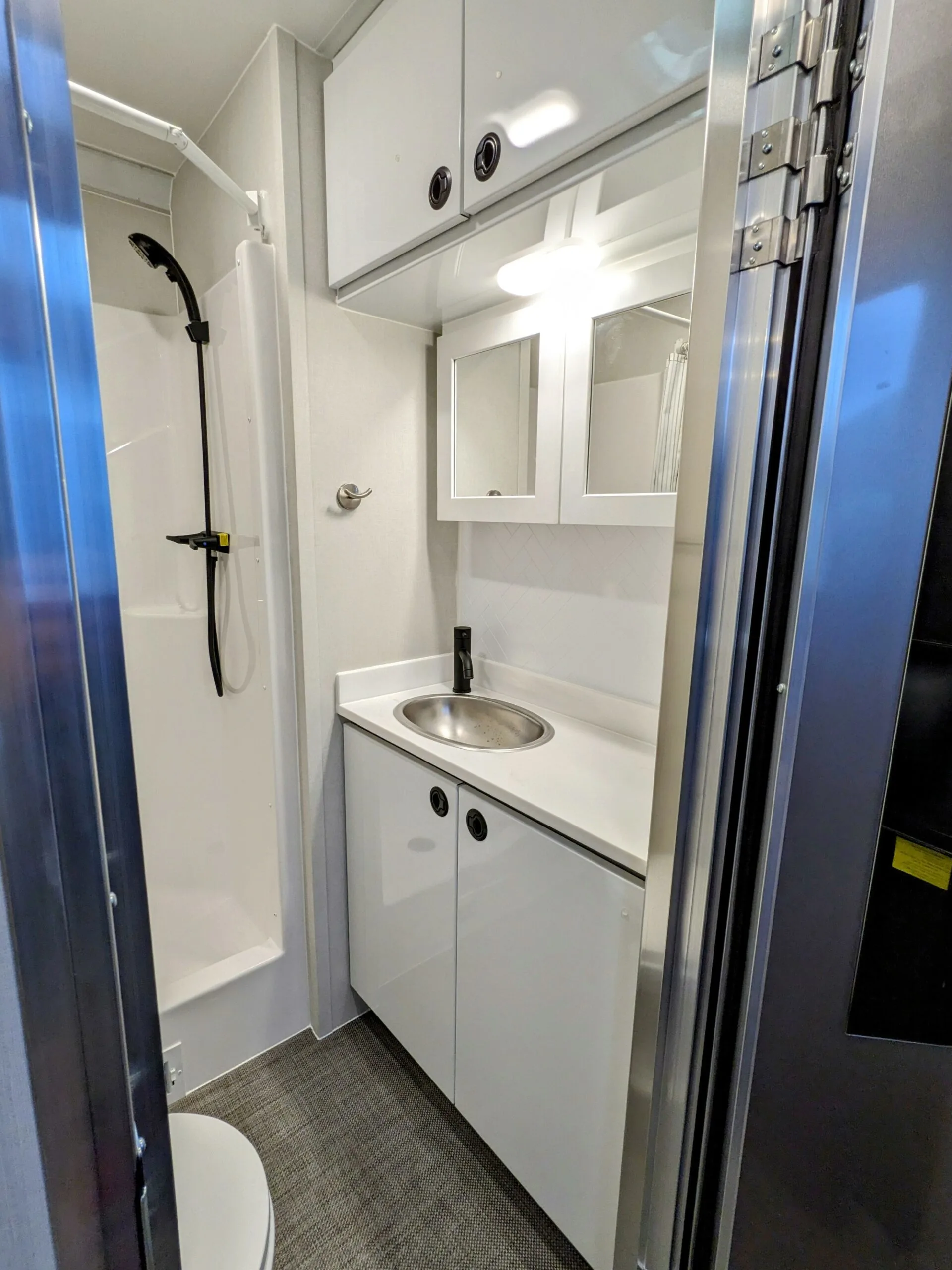 Bathroom with a sink and a shower.