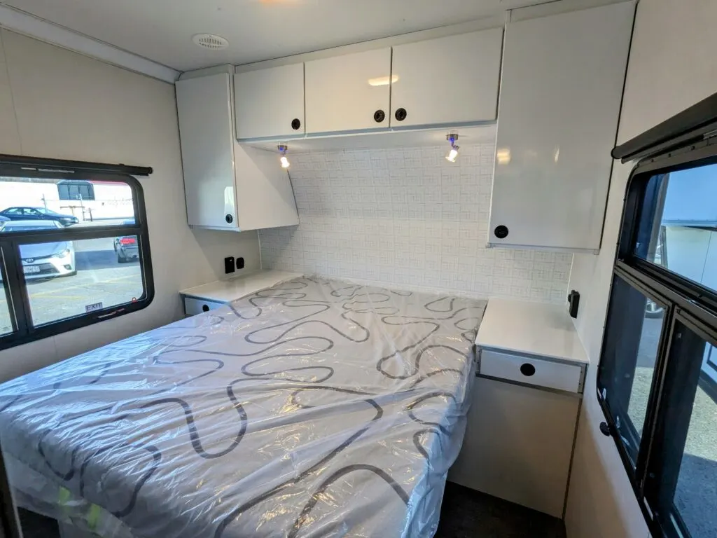 Bedroom with overhead cabinets.