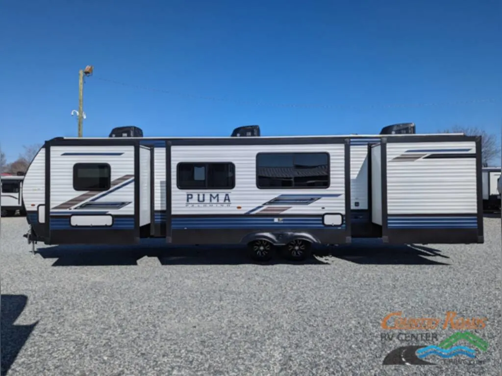 Side view of the New 2024 Palomino Puma 32RBFQ Travel Trailer RV.