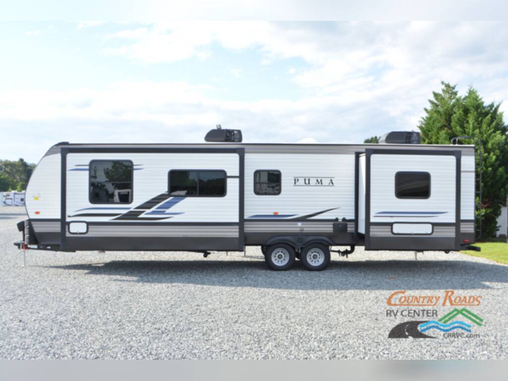 Side view of the New 2024 Palomino Puma 31FKRK Travel Trailer RV.