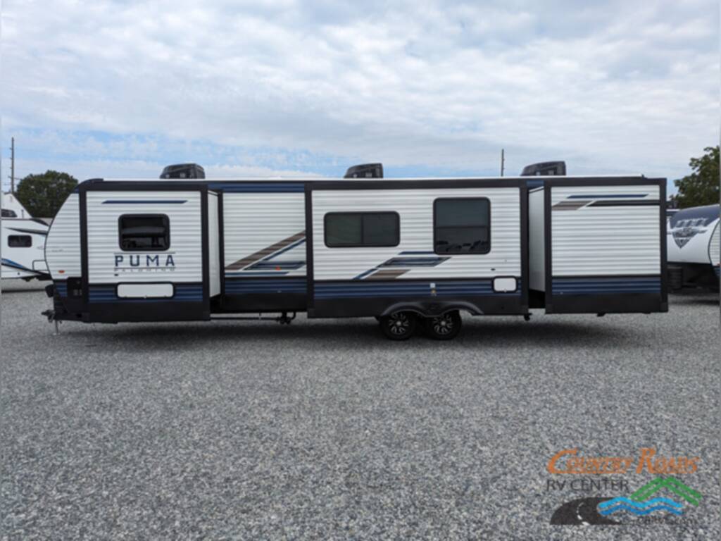 Side view of the New 2024 Palomino PUMA 32BHFS Travel Trailer RV.