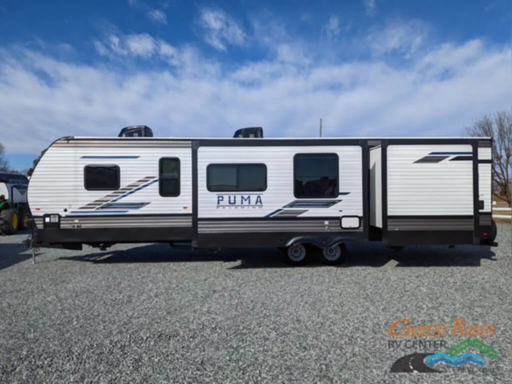 Side view of the New 2024 Palomino PUMA 32BH2B Travel Trailer RV.