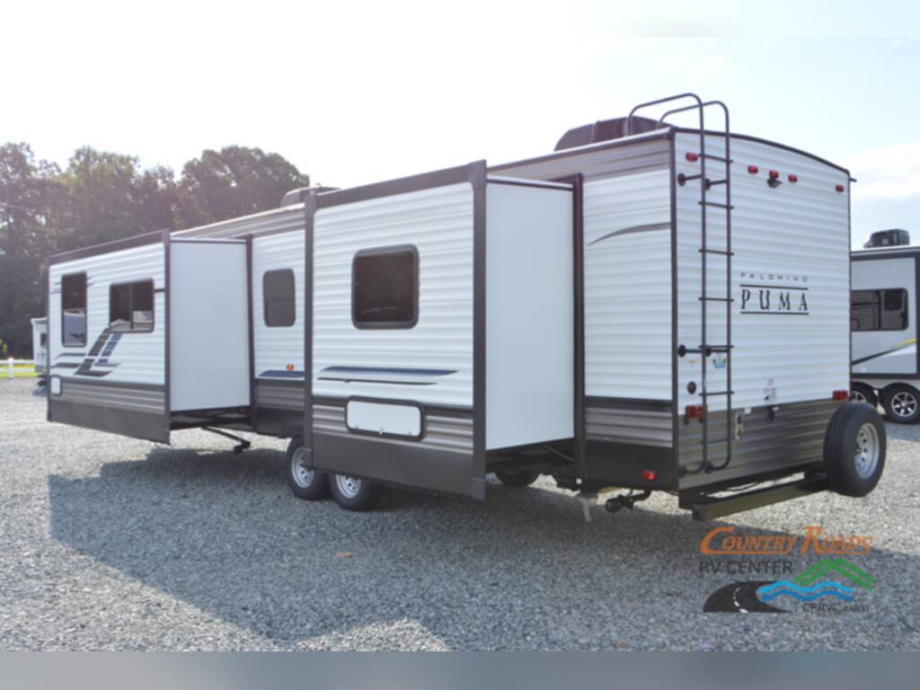 Rear-side view of the New 2024 Palomino Puma 31FKRK Travel Trailer RV.