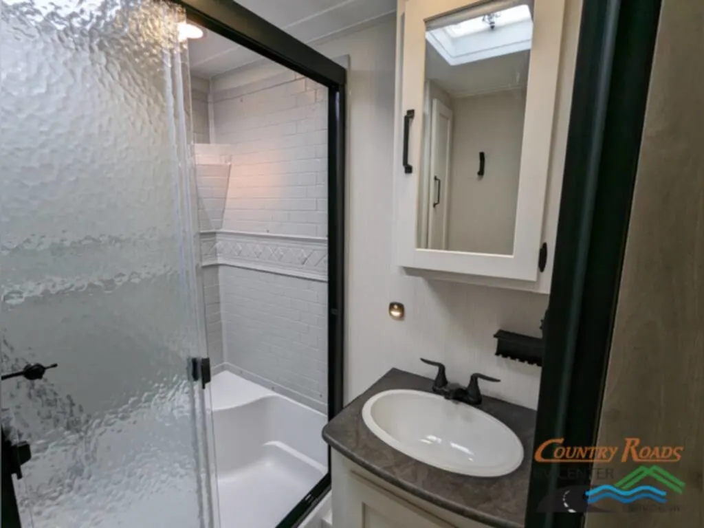 Bathroom with a sink and a walk-in shower.