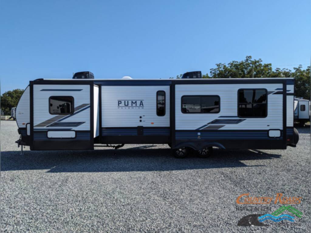 Side view of the New 2024 Palomino PUMA 30RKQS Travel Trailer RV.