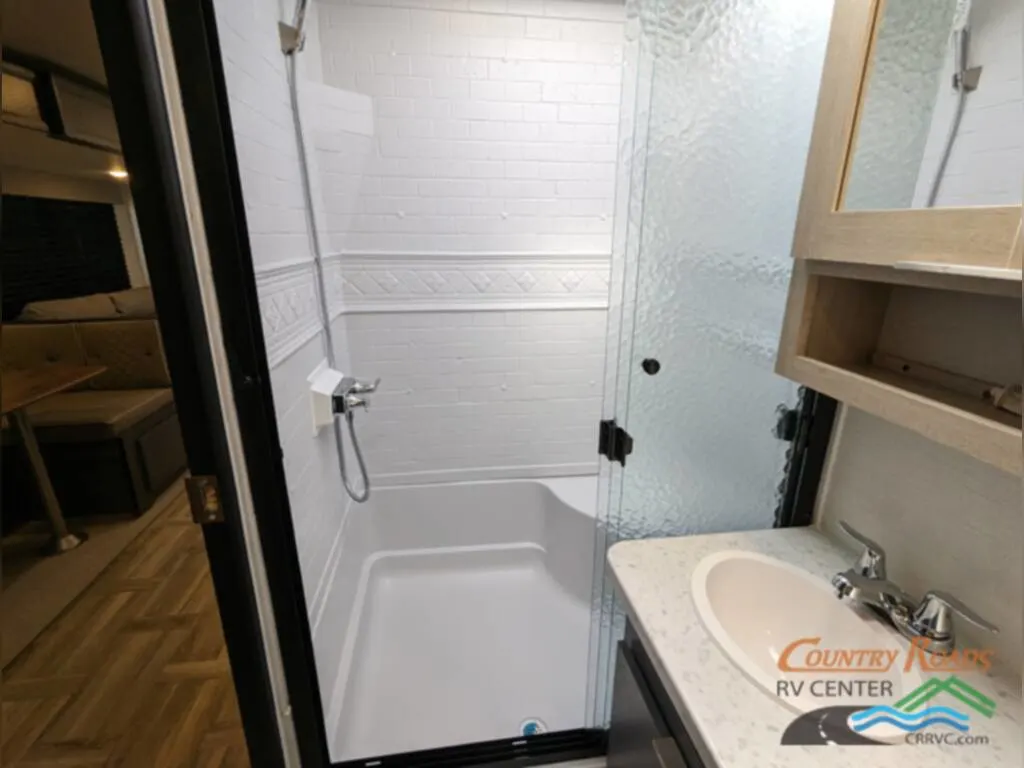 Bathroom with a sink and a walk-in shower.