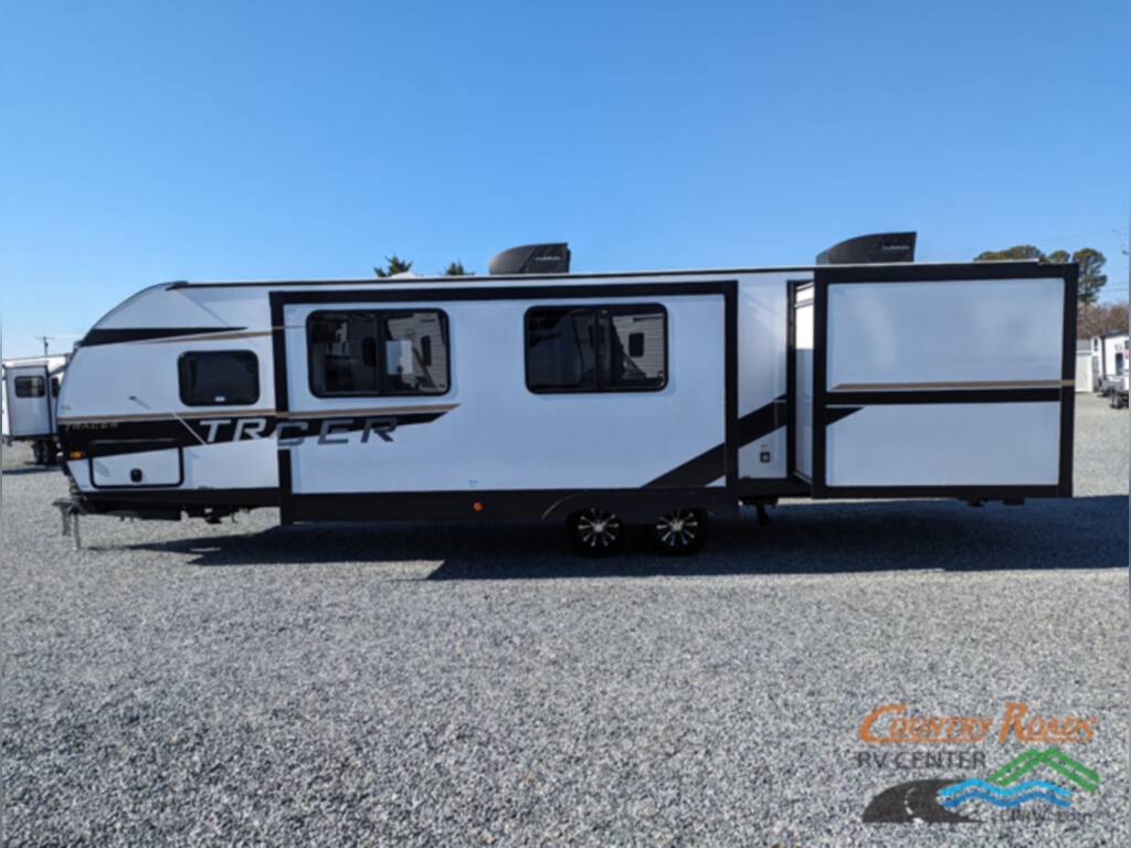 Side view of the New 2024 Prime Time TRACER 31BHD Travel Trailer RV.