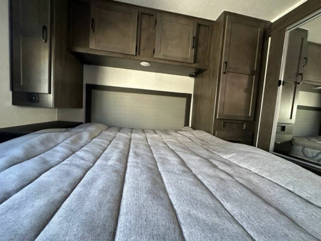 Bedroom with overhead cabinets.