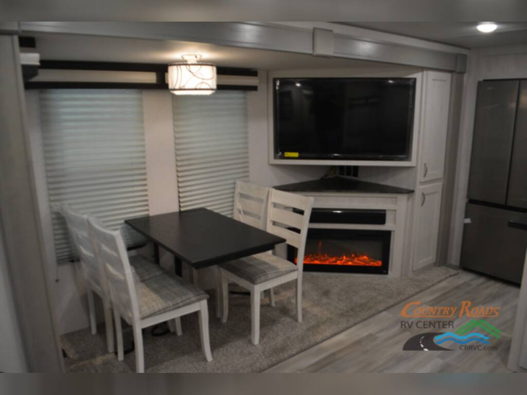 Dinette with a TV and a fireplace.